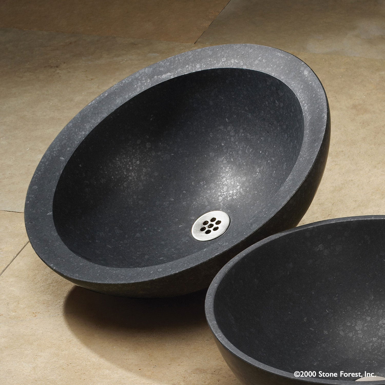 Beveled Round vessel sink carved  from basalt with a honed finish.
