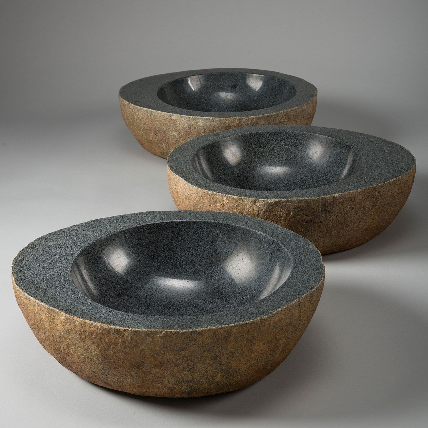 Natural Vessel sink in blue-gray granite with natural exterior and polished interior
