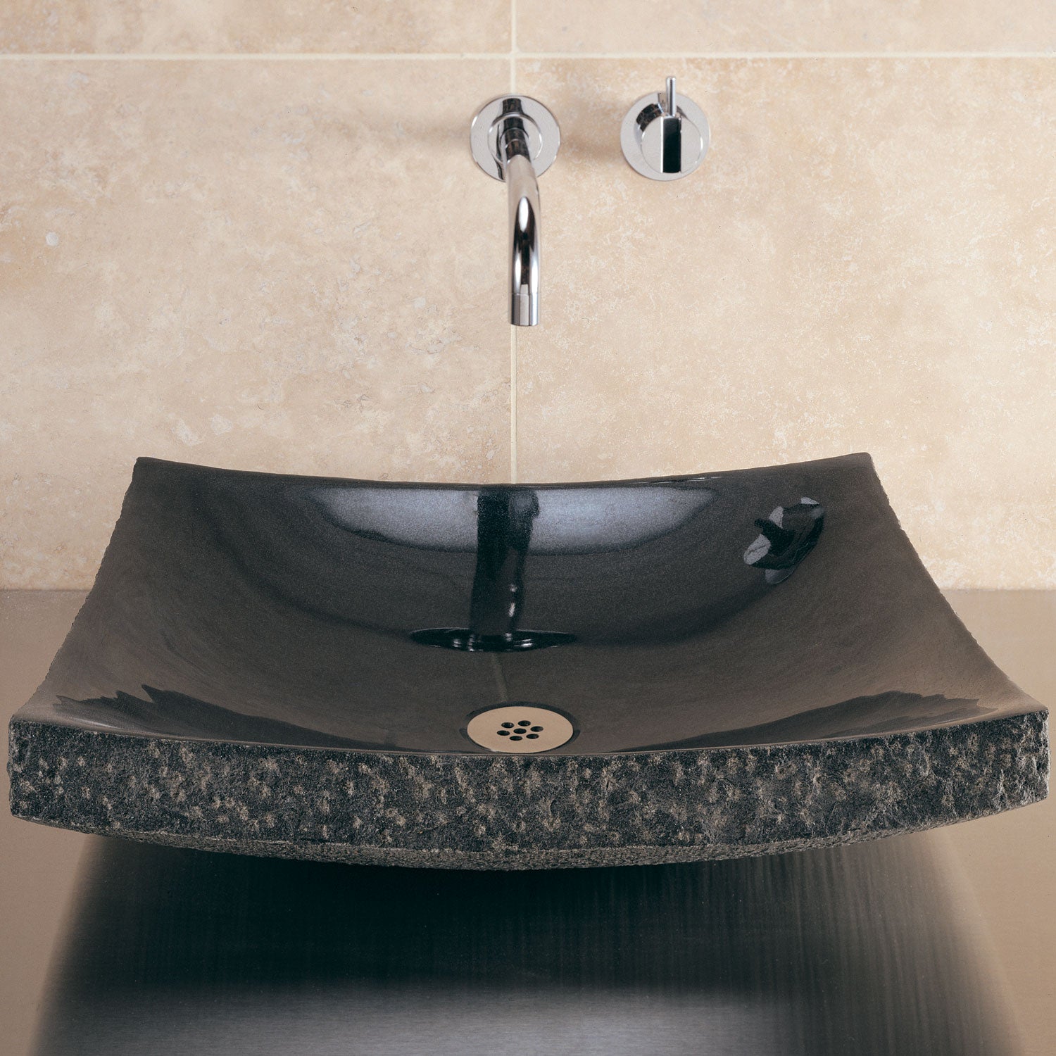 Zen vessel sink in black granite with chiseled edges and polished interior