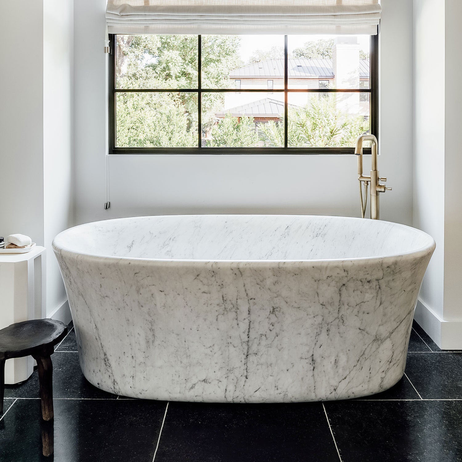 Calma Bathtub carved from  a solid block of carrara marbl