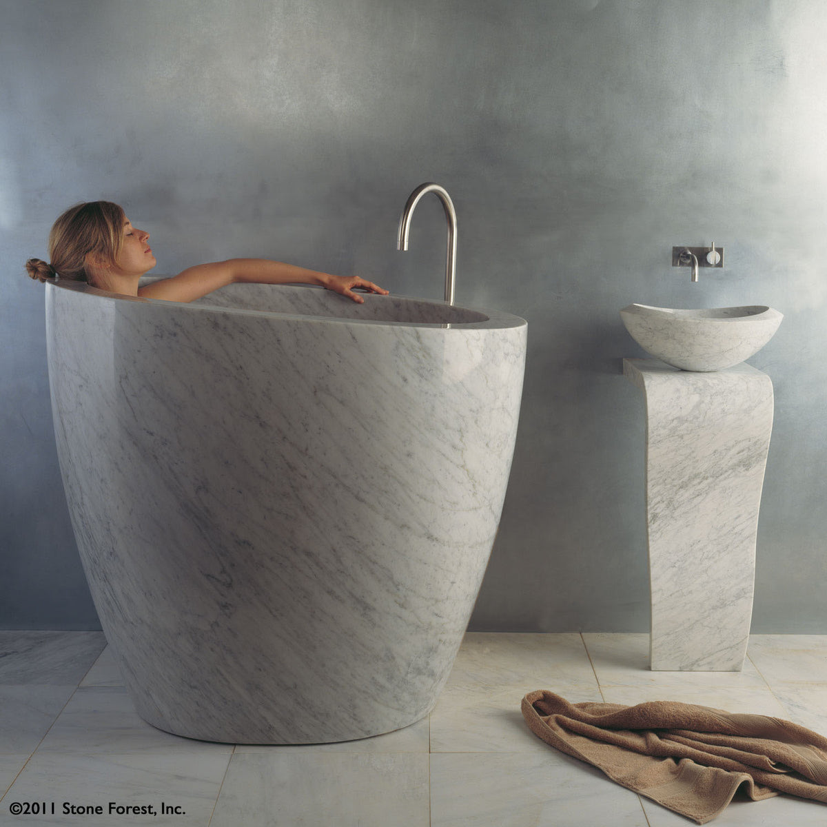 The free standing Stone Forest Eau Soaking Bathtub is hand-carved from a solid block of Carrara marble. Made on a custom basis. image 2 of 2