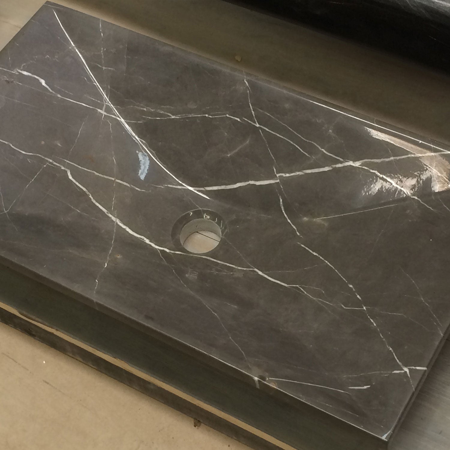 Custom Verona vessel sink in marquina taupe marble