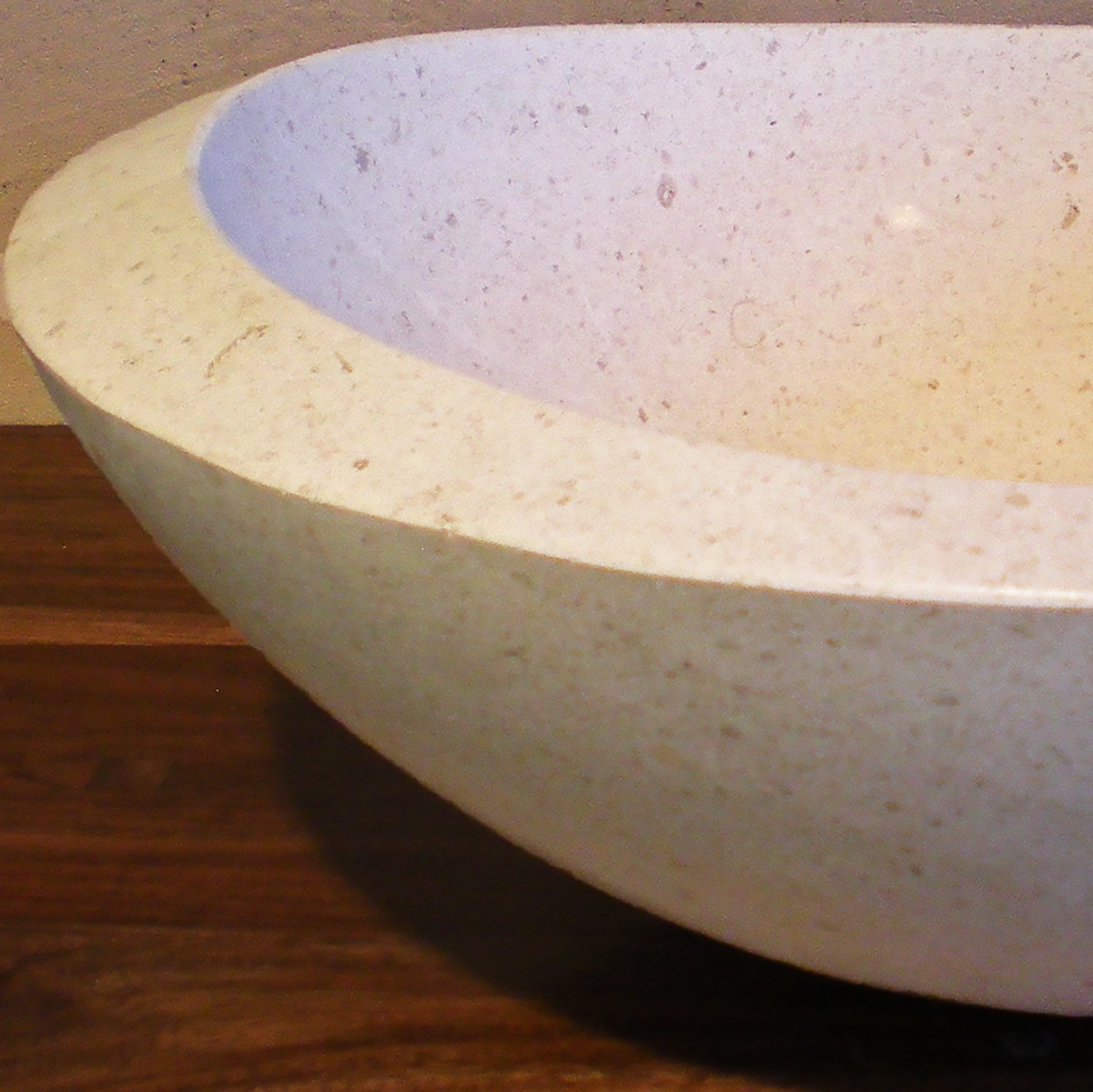 Custom Roma vessel sink in desert cream limestone