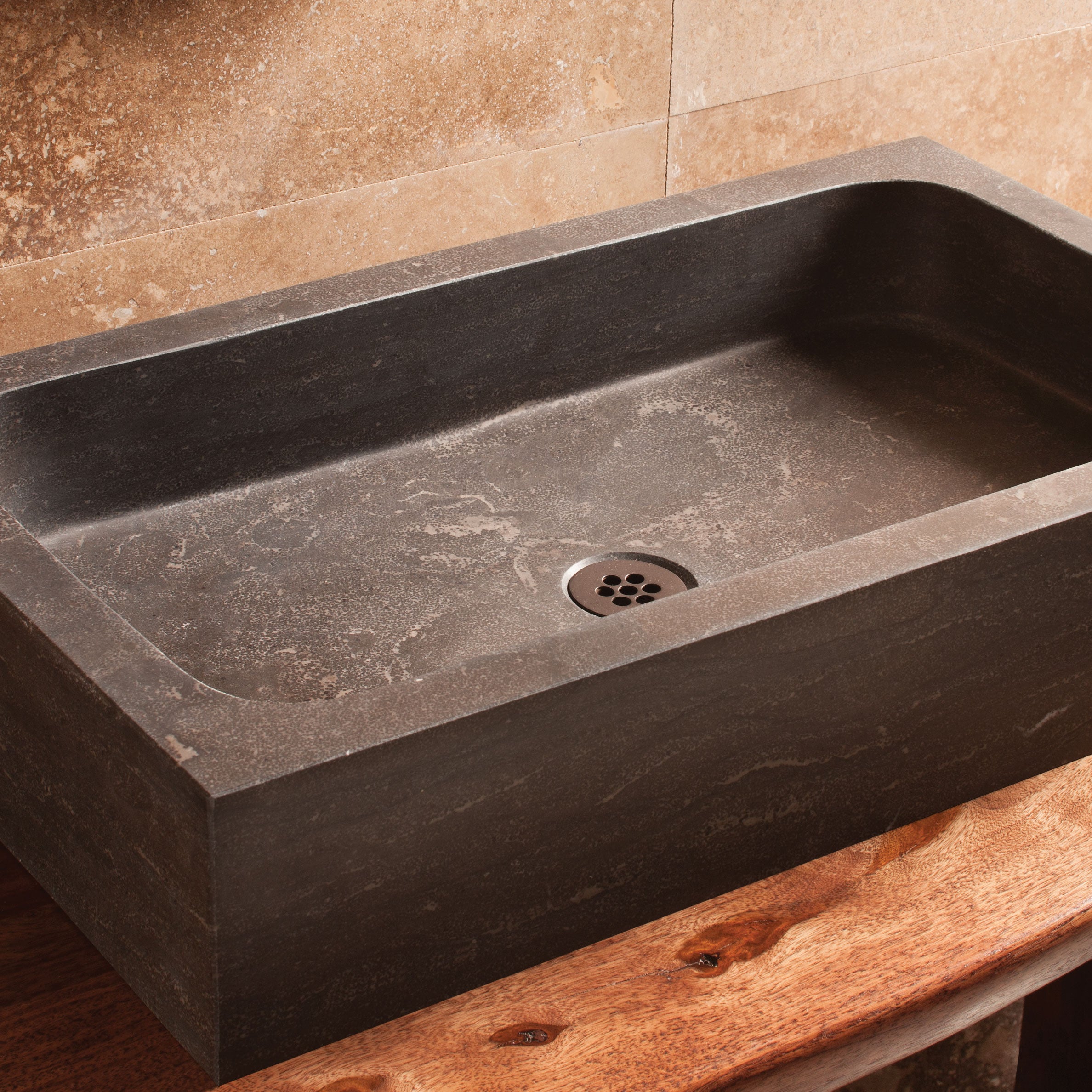 Milano bath sink in antique gray limestone