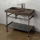 Tidal Pool Vanity Sink on Elemental Classic Legs with a crossbar.; with a folded metal tray shelf. Carved from noce basalt