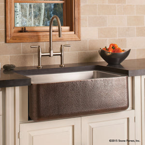 Farmhouse sink with stainless steel interior and hammered copper exterior image 2 of 3