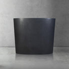 Custom Infinity Pedestal Sink in honed black granite - front view