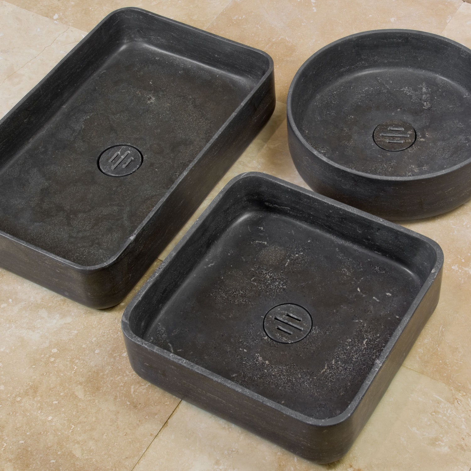three contour vessel sinks in antique gray limestone