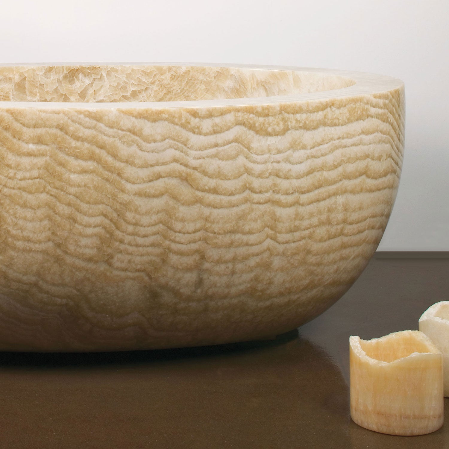 close up n oval bathtub in honey onyx