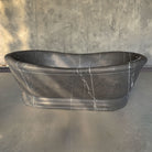 Custom Old World Bathtub carved from a block of marquina taupe