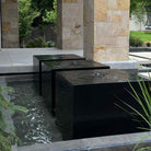 Custom garden fountains carved from black granite
