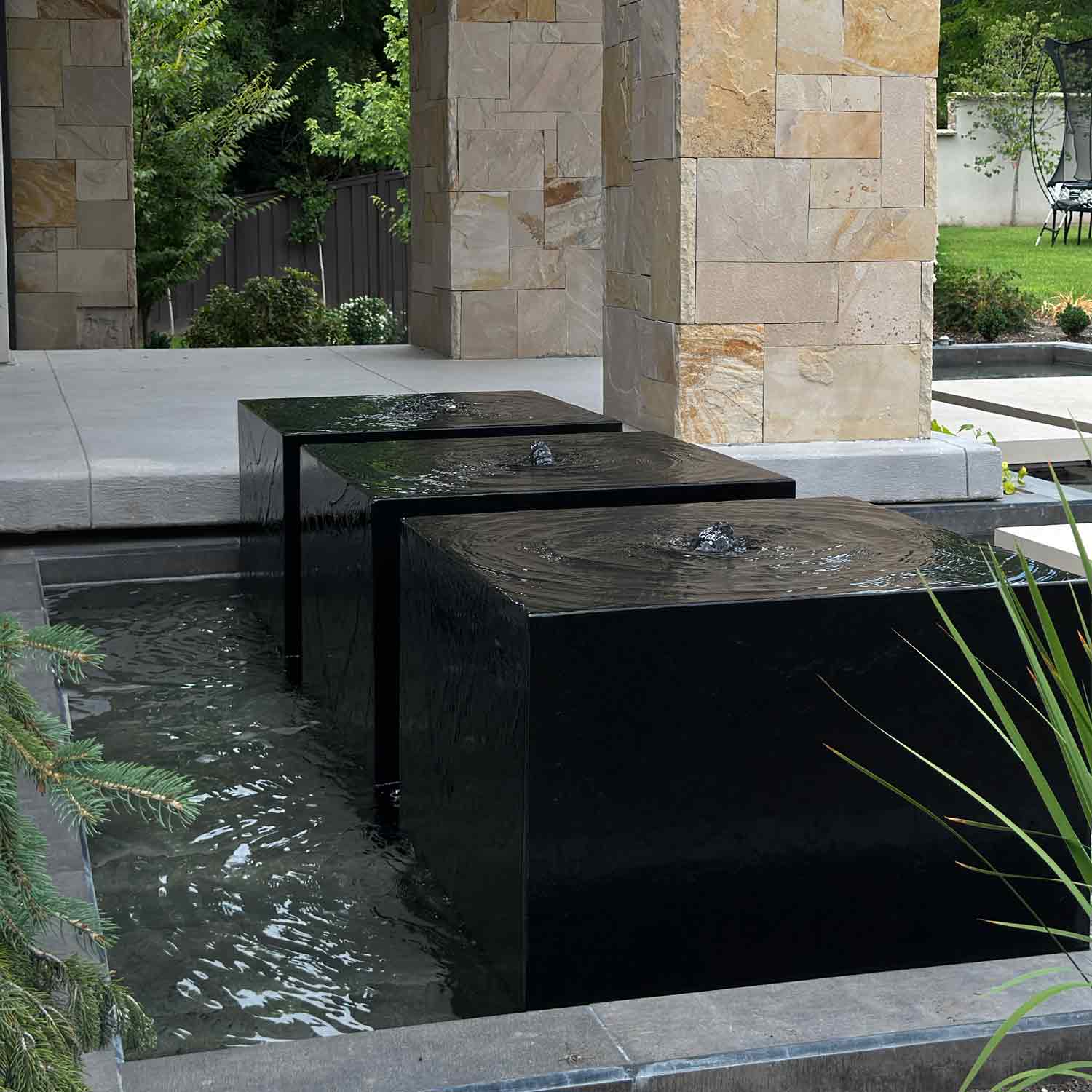Custom garden fountains carved from black granite