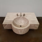 A custom vanity in Siena Silver Gray Marble featuring an integral sink