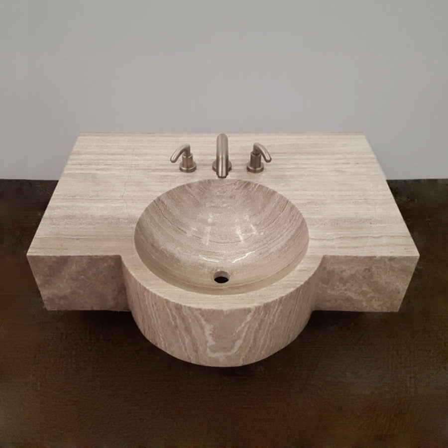 A custom vanity in Siena Silver Gray Marble featuring an integral sink