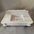 Luna Bianca Marble bathroom vanity with sink on a gray background