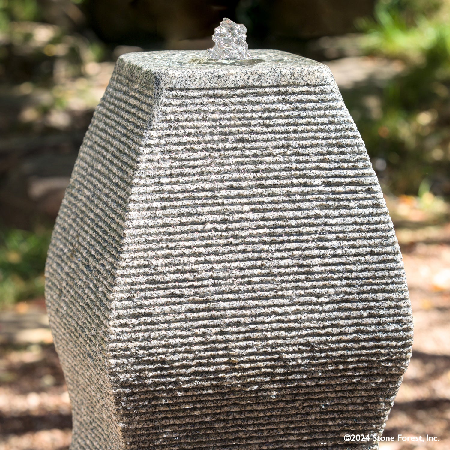 The Wave Fountain sculpted from a block of black & white  granite.