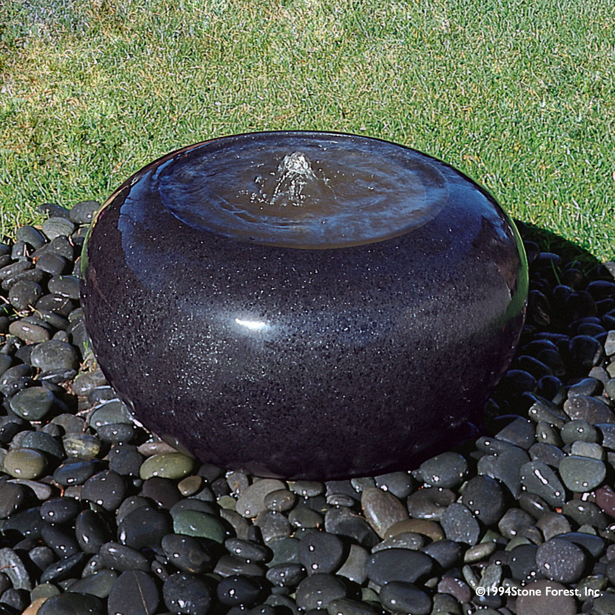 Stone Forest Bowl garden fountain carved from black granite image 1 of 1