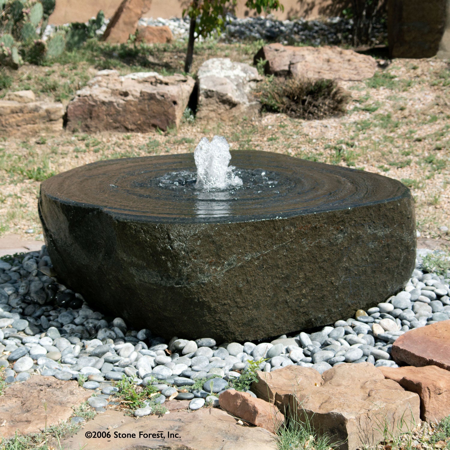 Stone Forest large Swirl garden fountain carved from granite