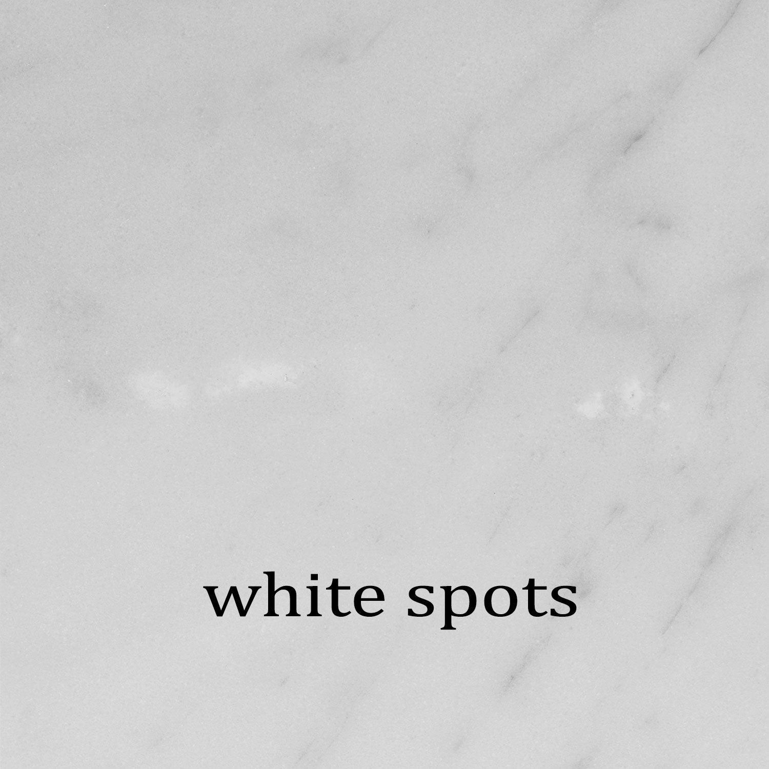 Carrara marble sample showing common anomaly of white spots