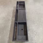 A three-piece black vanity sink made of basalt, placed on a concrete surface.