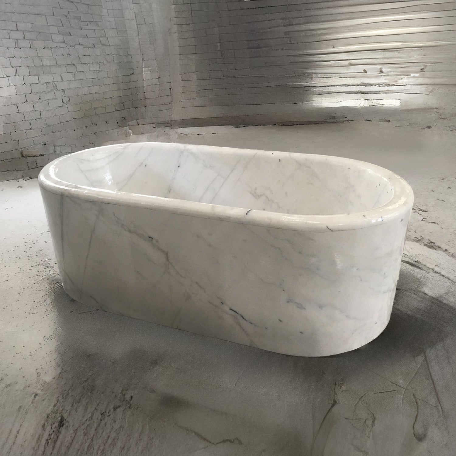 A white Carrara marble racetrack bathtub.