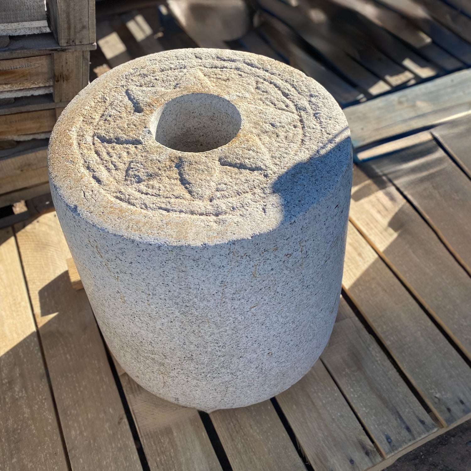 Colossal Antique Grinding stone in beige granite