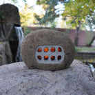 Ishi Lantern with light through stone window side 