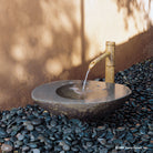 Stone Forest Wabi Basin used as garden fountain with bamboo spout - Hand carved from granite