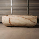 A large, rectangular onyx trough planter with multi-color patterns, displayed indoors.