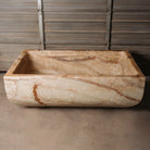 A large, rectangular onyx trough planter with multi-color patterns, displayed indoors.