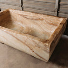 A large, rectangular onyx trough planter with multi-color patterns, displayed indoors.
