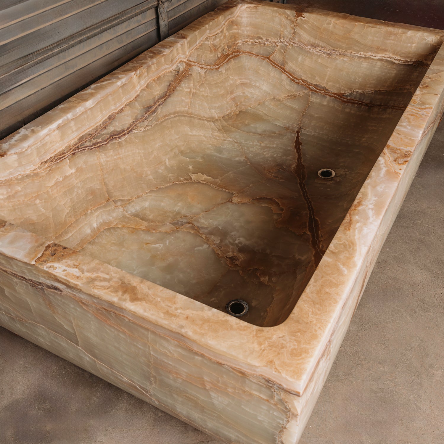 A large, rectangular onyx trough planter with multi-color patterns, displayed indoors.