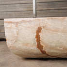 Detail of a large, rectangular onyx trough planter with multi-color patterns, 
