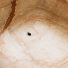 Detail of a large, rectangular onyx trough planter with multi-color patterns, 