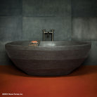 Facet Bathtub in antique gray limestone