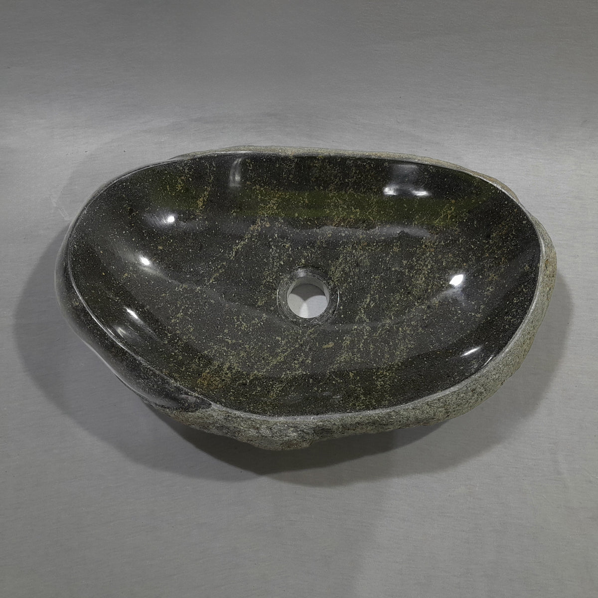 Natural stone sink on a gray background image 1 of 2