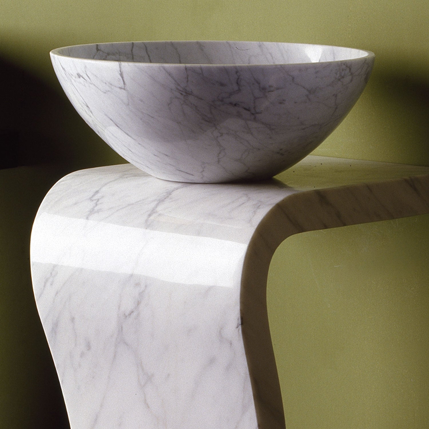 Wave pedestal sink in Carrara marble