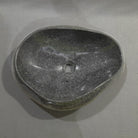 Natural stone sink on a gray background