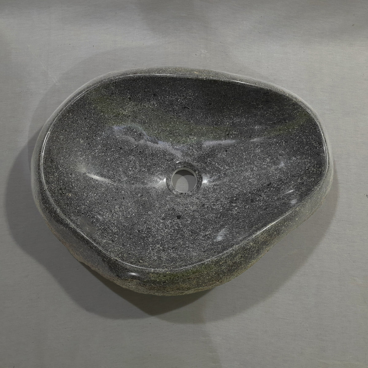 Natural stone sink on a gray background image 1 of 2