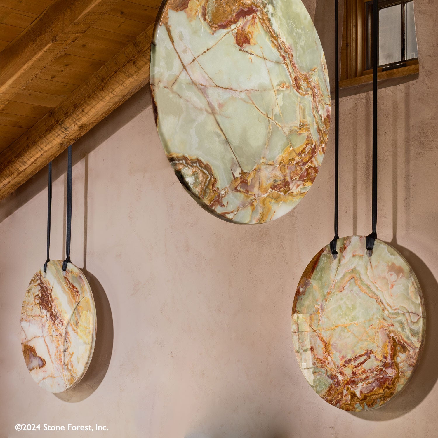 These gallery-worthy hanging sculptures are carved from blocks of premium multi-color onyx with a high-polish finish and feature a crescent design on one side.