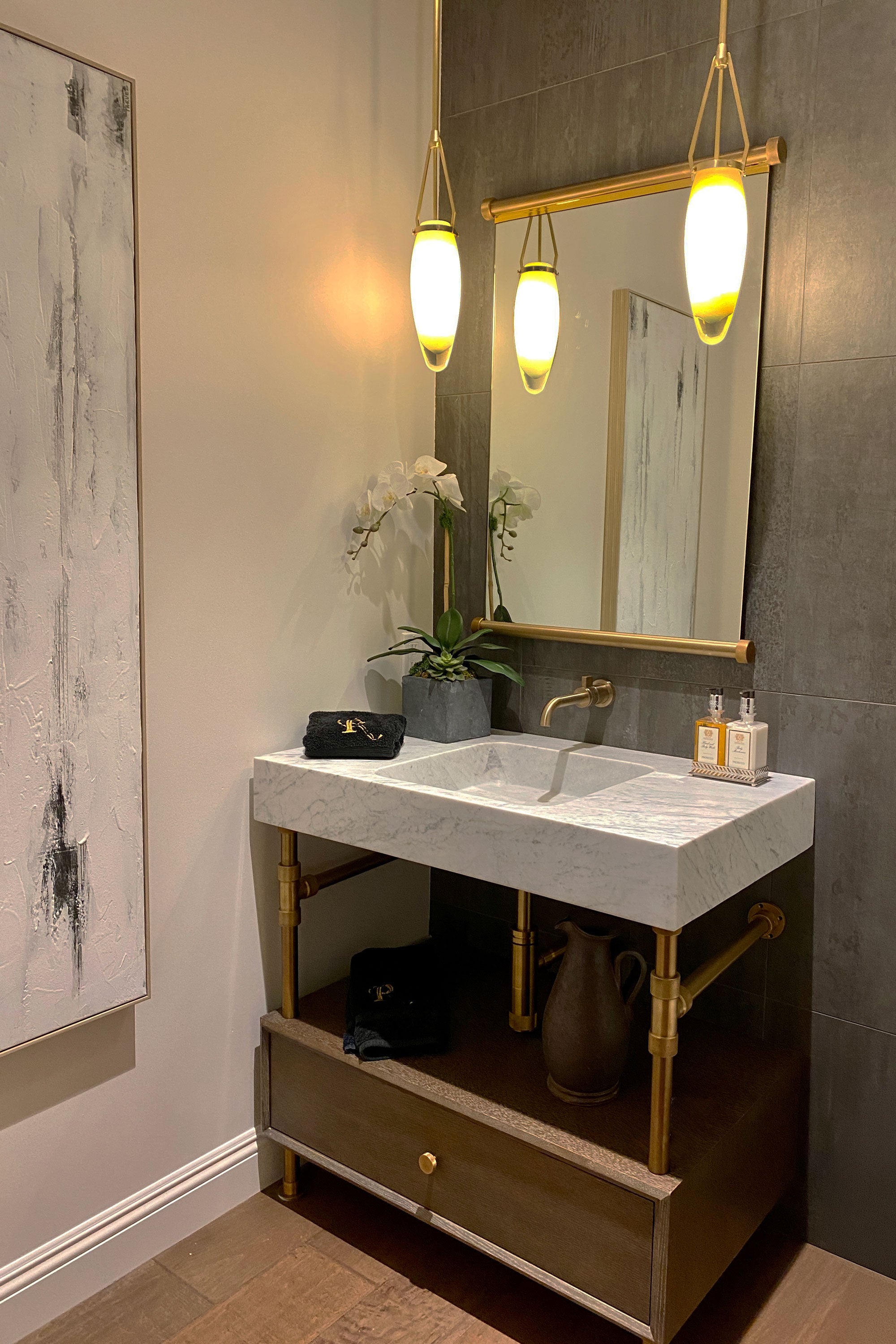 Bathroom vanity with sink, mirror, and decorative elements.