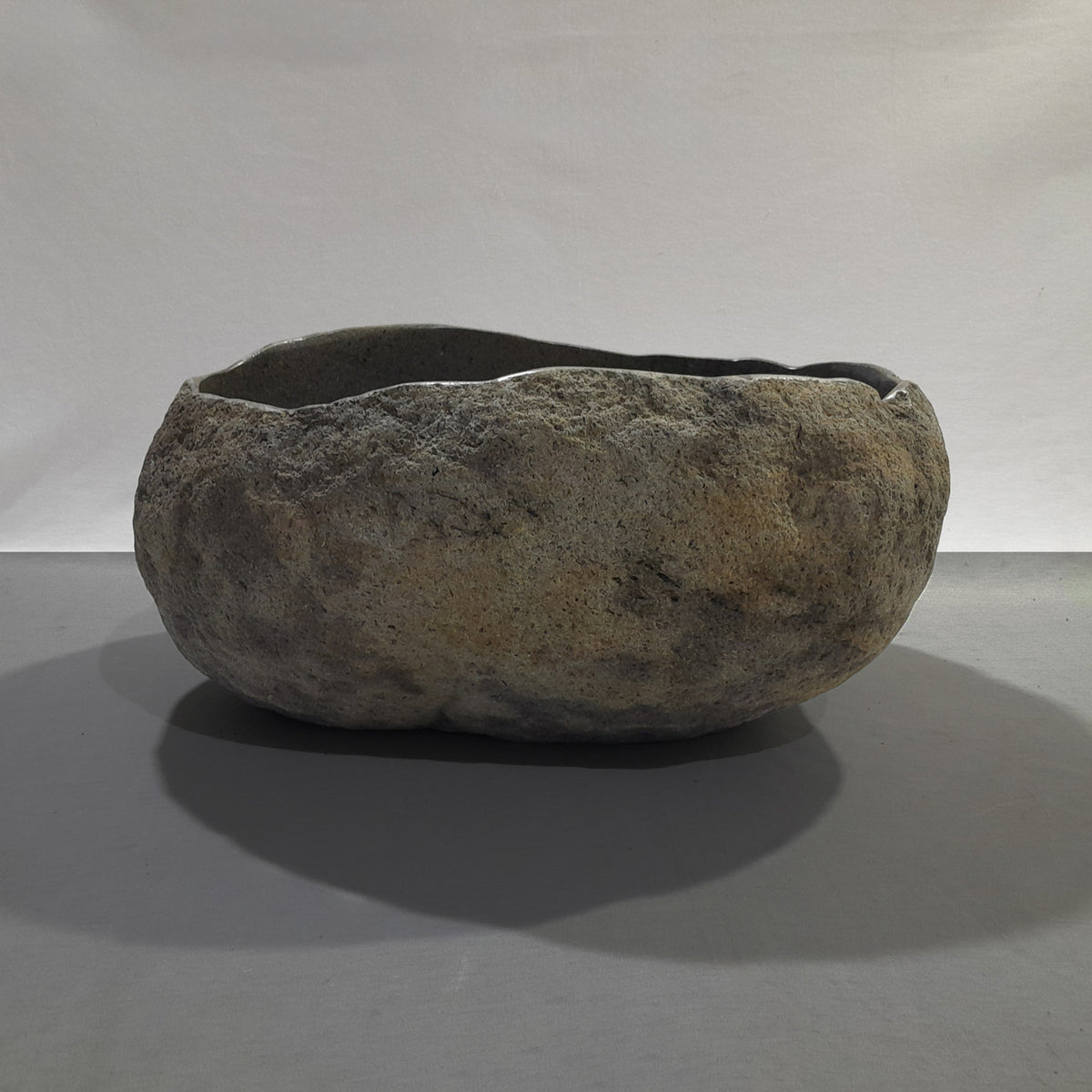 Natural stone sink on a gray background image 2 of 2