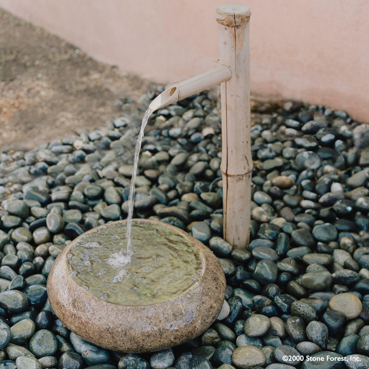 Riverstone Wabibasin as fountain with bamboo waterspout image 1 of 5