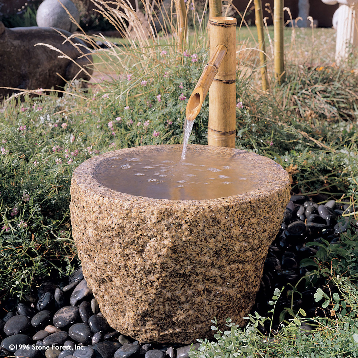 Stone Forest Rough Vessel carved from beige granite, used as a garden fountain. Can also be used as a Tsukubai image 1 of 3