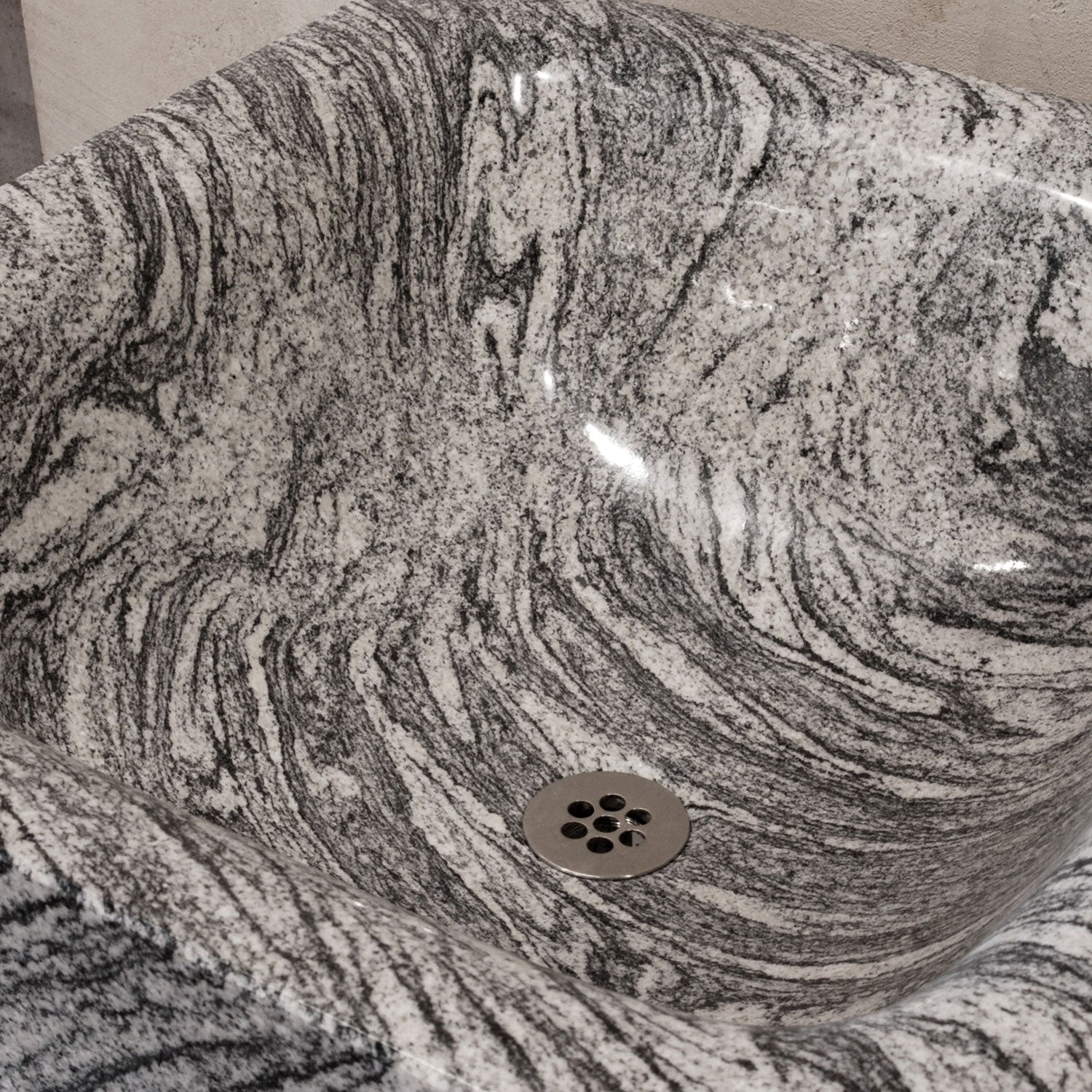 Close up of bathroom sink in Cumulo Granite