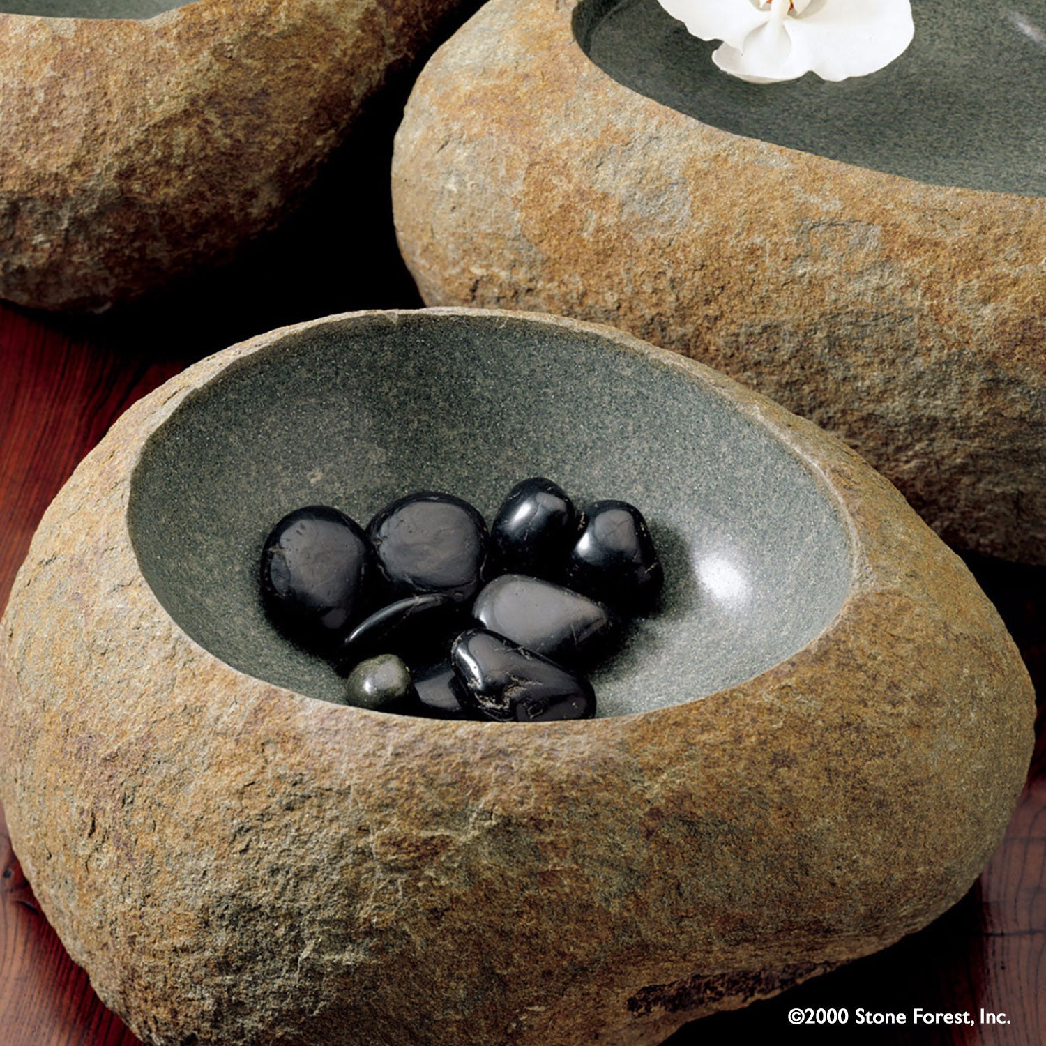 Stone Wabi Basin carved from gray granite boulders