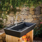 Salus Potting Sink in honed black granite. 