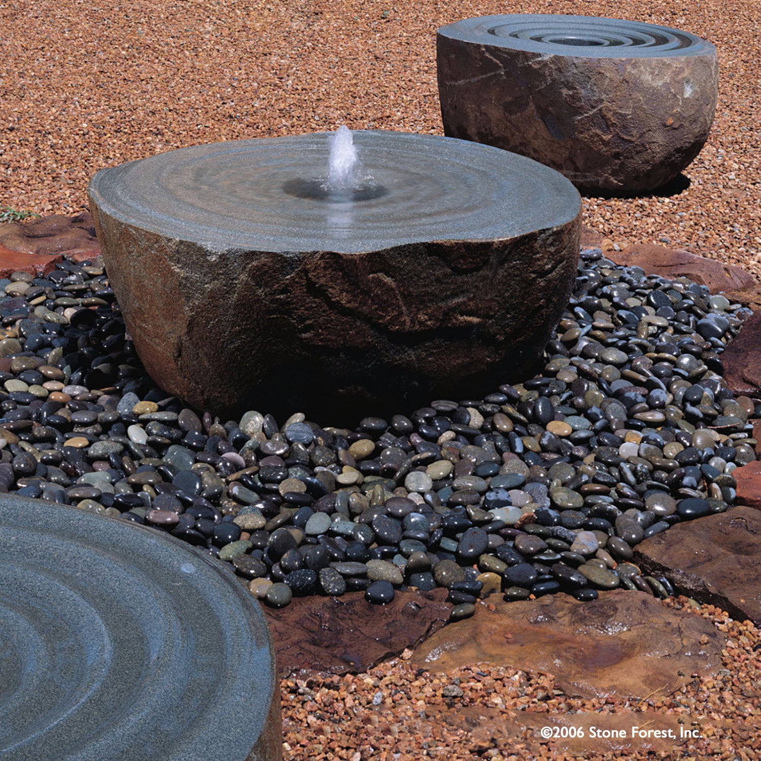 Three Stone Forest small Swirl garden fountains carved from granite