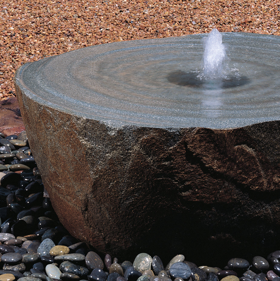 Swirl fountain in natural boulder material