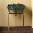 Fluted Lumbre Bath Sink carved from Verde Indio Marble on top of an Aged Brass  Elemental  Facet Crossbar Stand